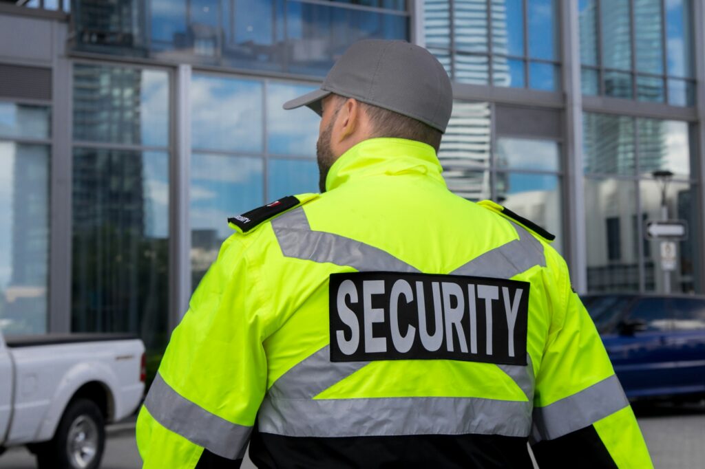 Security guard in uniform patrolling a residential area.