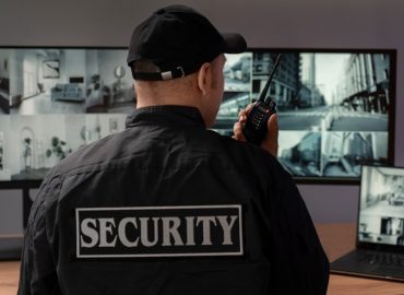 portrait-male-security-guard-with-radio-station-camera-screens_23-2150368714